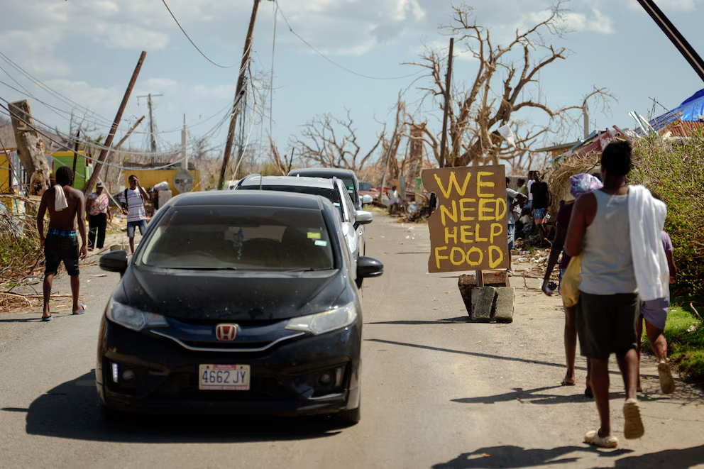 A sign asking for help and food after Hurricane Melissa in Westmoreland Parish, Jamaica, on November 4, 2025. (Erin Schaff/The New York Times)