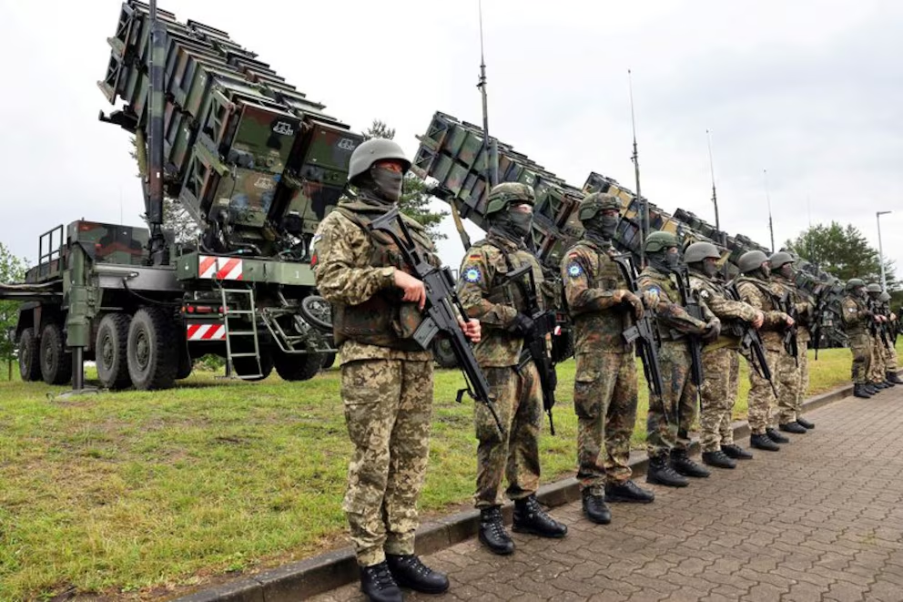 Soldiers stand in position during Ukrainian President Volodymyr Zelensky's visit to a training area where Ukrainian troops receive instruction on the Patriot anti-aircraft missile system (Jens Buttner/REUTERS)